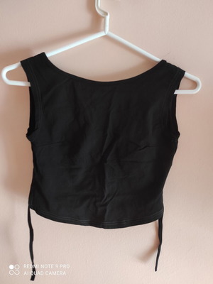 Black shirt with open back like new, sizes XS, S, M