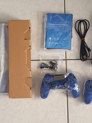 PlayStation 4 Slim Days of Play Edition 1TB used with 2 controllers and game