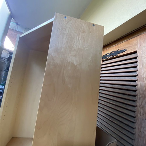 Polygonal beech-colored bookcase used, adjustable shelves
