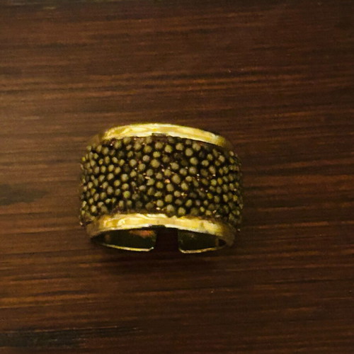 Steel ring gold plated with embossed brown designs like new, adjustable