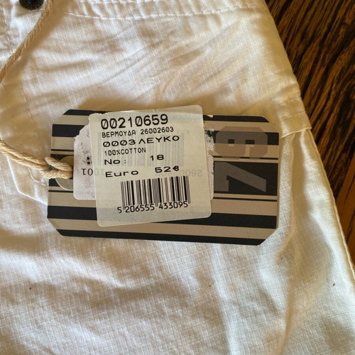 White bermuda shorts new with light stain, kids