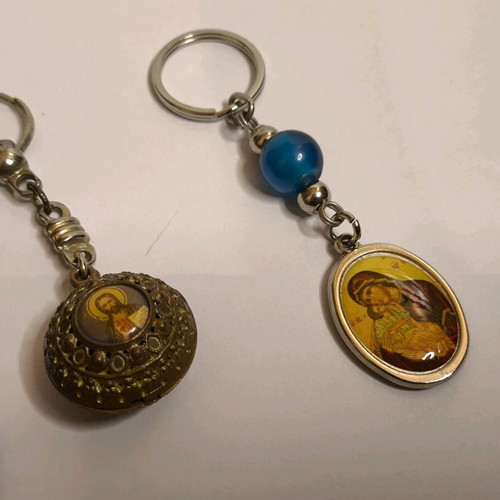 Set of 3 keychains like new with Meteora, evil eye and religious images