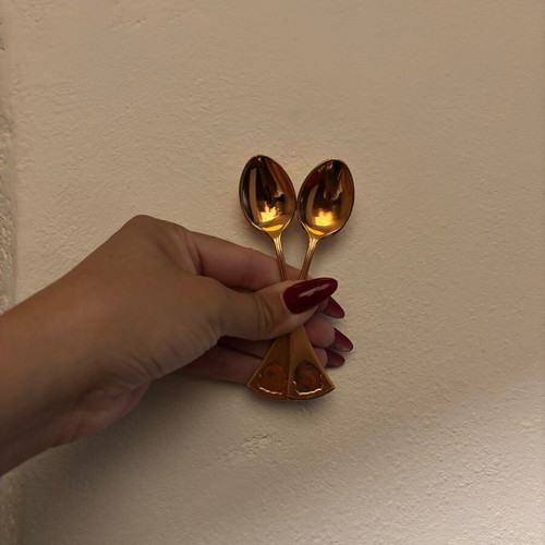 Used bronze and copper spoons