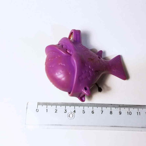 Plastic toy purple fish used with closing mouth