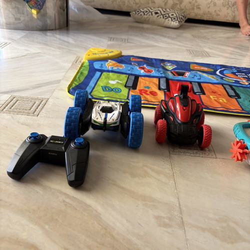 Toy set used with musical mat piano, remote car, boat, airplane, truck, football, figurine