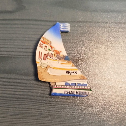 Set of 12 souvenir fridge magnets from various regions