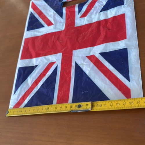 Plastic bag with English flag and small empty London bus box like new