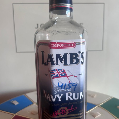 Lamb’s Navy Rum like new with hexagonal bottle