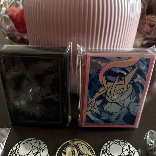 Pokémon Sleeves with Coins and Dice new from Pitch Black and Chaos Rising ETB
