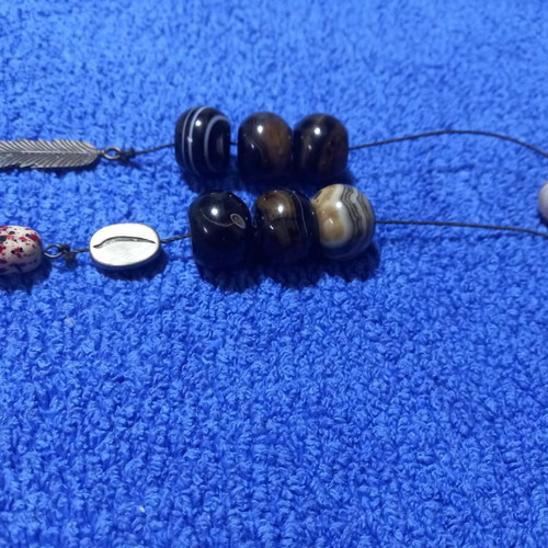 Handmade Greek begleri with natural agate beads and decorative feather charm