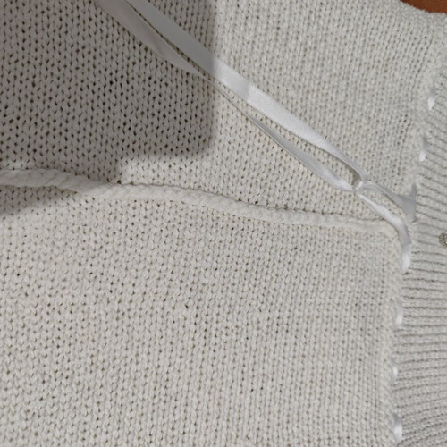 White knitted halterneck top used, size S-M, decorated with ribbons and beads