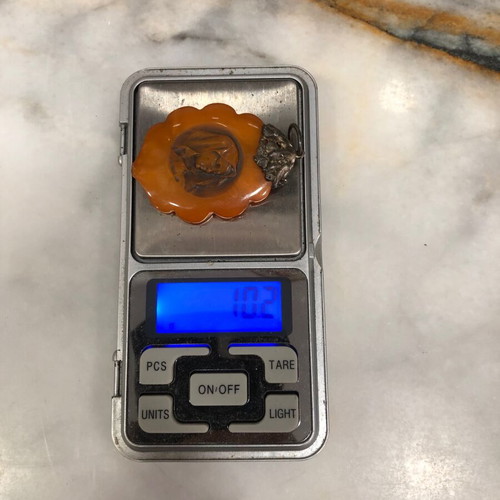 Amber pendant used, orange color