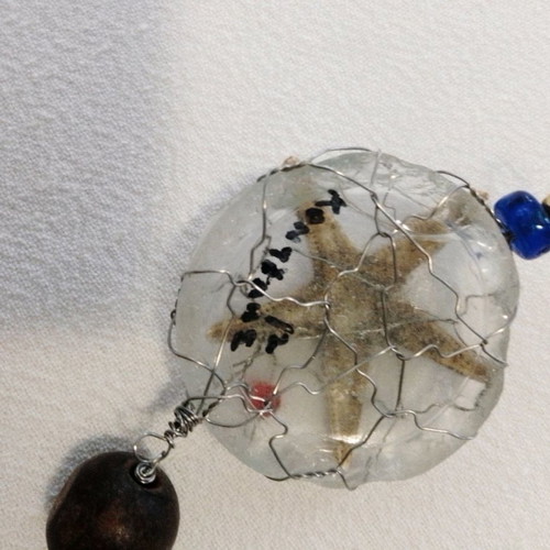 Art micro sculpture used with glass, wood, beads, starfish