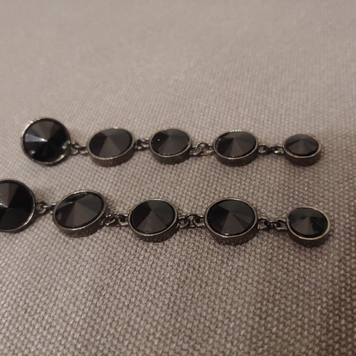 Long earrings unused with black stones
