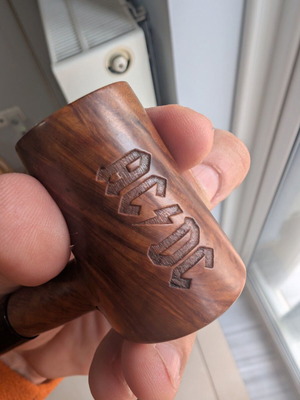 Handmade smoking pipe used with carved AC/DC logo made of heather wood