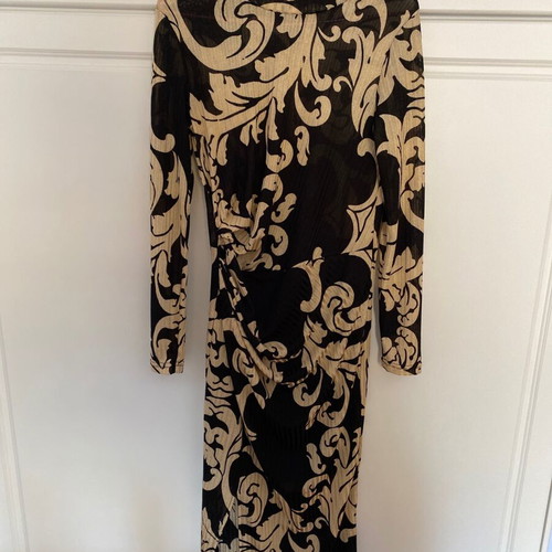 Dress with patterns like new, size large but tight fit, thin fabric