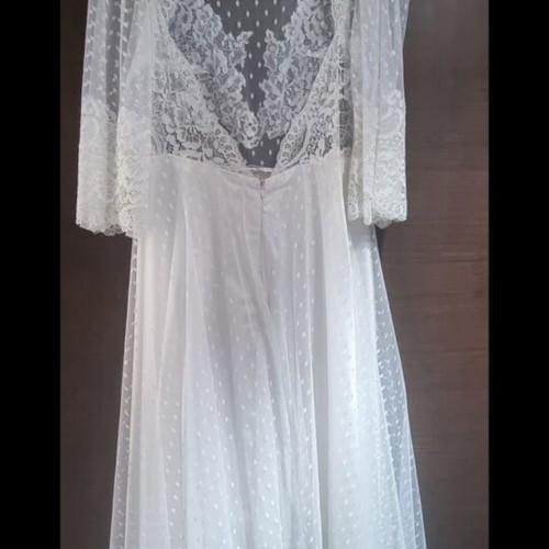 Romantic vintage-inspired wedding dress with polka dot tulle and lace
