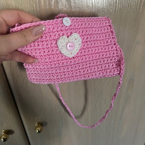 Children's pink knitted bag with heart and button