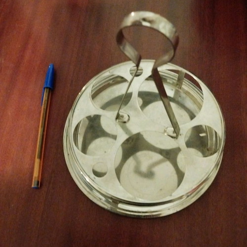 Metal cafe-style coaster used, for small glasses