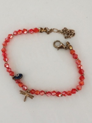 Bracelet with red beads, dragonfly and evil eye used