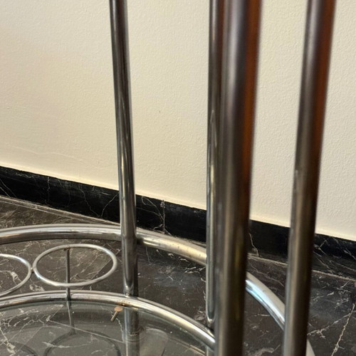 Vintage round trolley bar used with chrome tubular steel and glass shelves