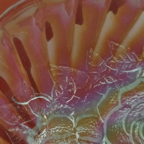Vintage iridescent glass plate with embossed rose design