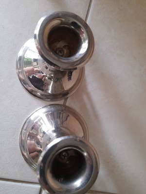 Silver candlestick set used with grape decoration
