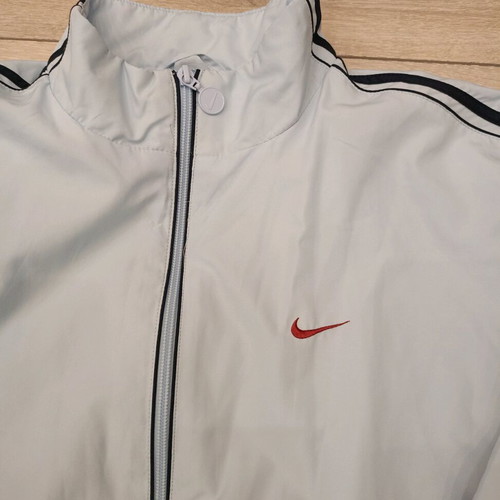 Vintage Nike windbreaker jacket used in ice blue with dark navy details