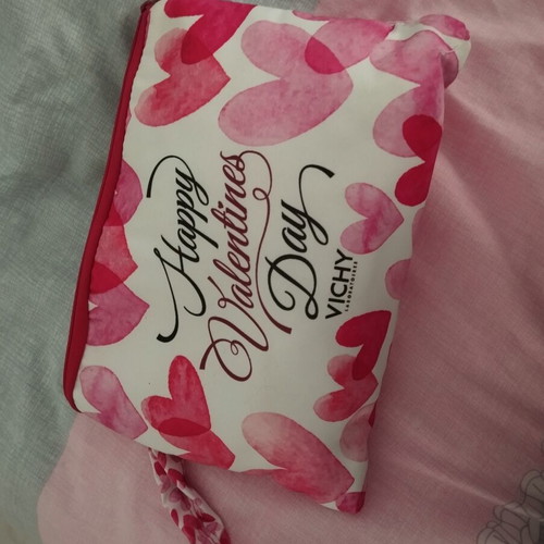Toiletry bag A.L.E. used, red and pink hearts, slight lipstick stain