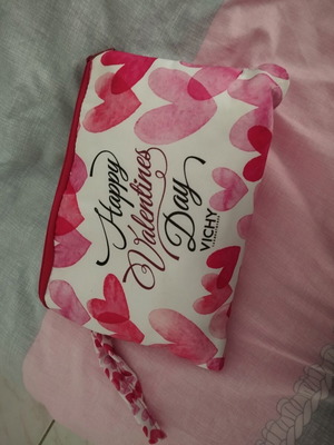 Toiletry bag A.L.E. used, red and pink hearts, slight lipstick stain