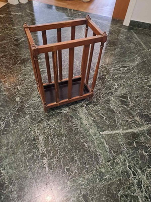 Vintage wooden umbrella stand used for hallway