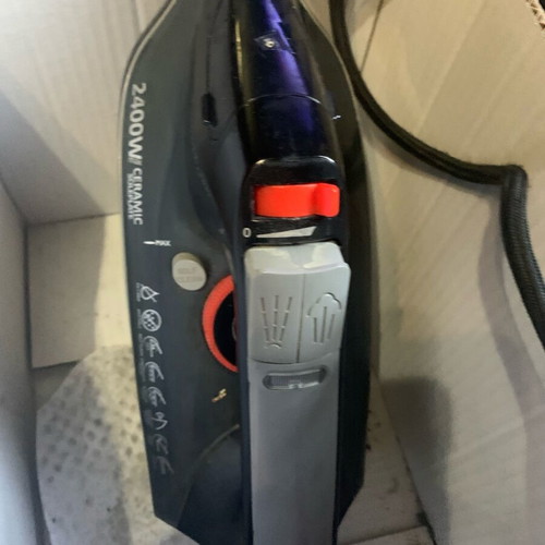 Ceramic steam iron used with steam and water outlets