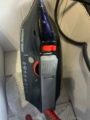 Ceramic steam iron used with steam and water outlets