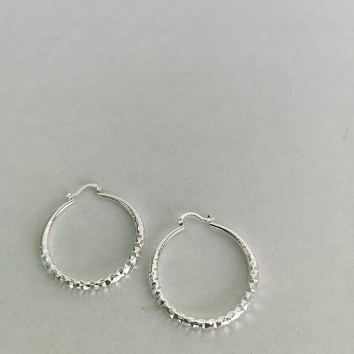 Silver-tone hoop earrings like new with diamond-cut texture