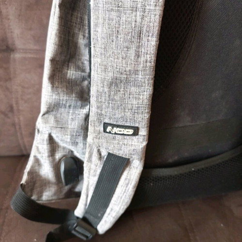 NOD anti-theft backpack used, gray with laptop compartment and USB