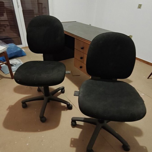 Office desk set used with three drawers and two chairs with wheels