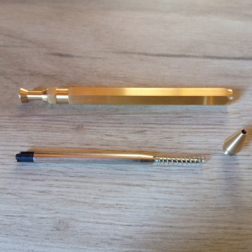 Hexagonal brass pen used, with g2 refill included