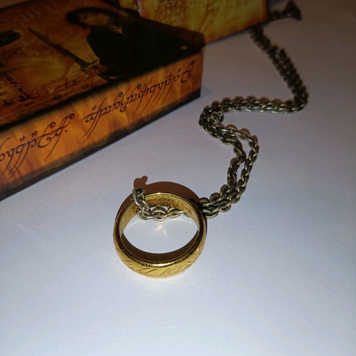 Lord of the Rings ring used with chain, box, and book