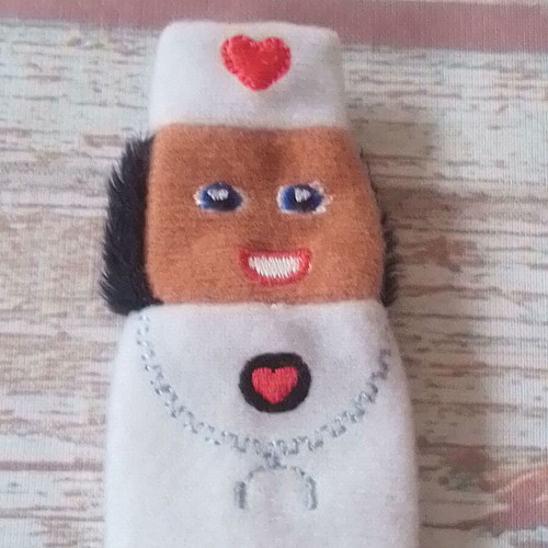 Plush finger puppet nurse used for puppet theater