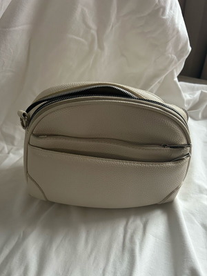 White crossbody bag leather type used with adjustable strap