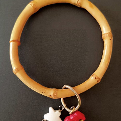 Bamboo bangle with tiki charms like new