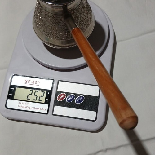 Traditional copper briki with embossed designs and wooden handle, like new