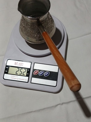 Traditional copper briki with embossed designs and wooden handle, like new