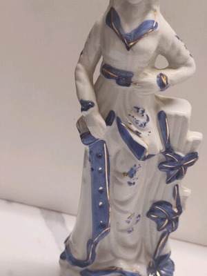 Porcelain female statue with blue and gold Victorian details