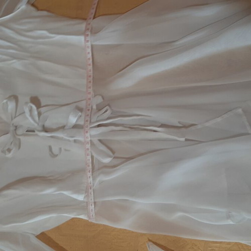 White women's shirt like new, asymmetrical with bows and cords