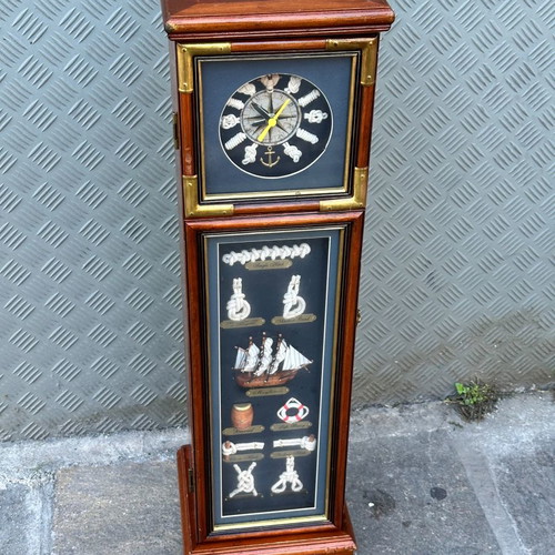 Decorative floor clock used with cabinet