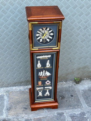 Decorative floor clock used with cabinet