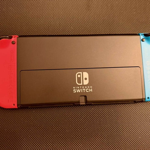 Nintendo Switch OLED used with carrying case and 256GB memory card