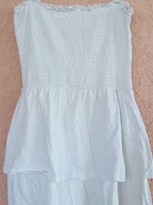White summer mini dress with smocked bodice and tiered skirt