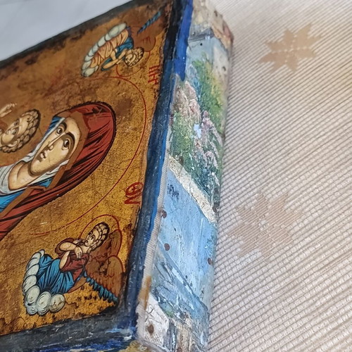 Cardboard box with silk-screened religious icon on canvas
